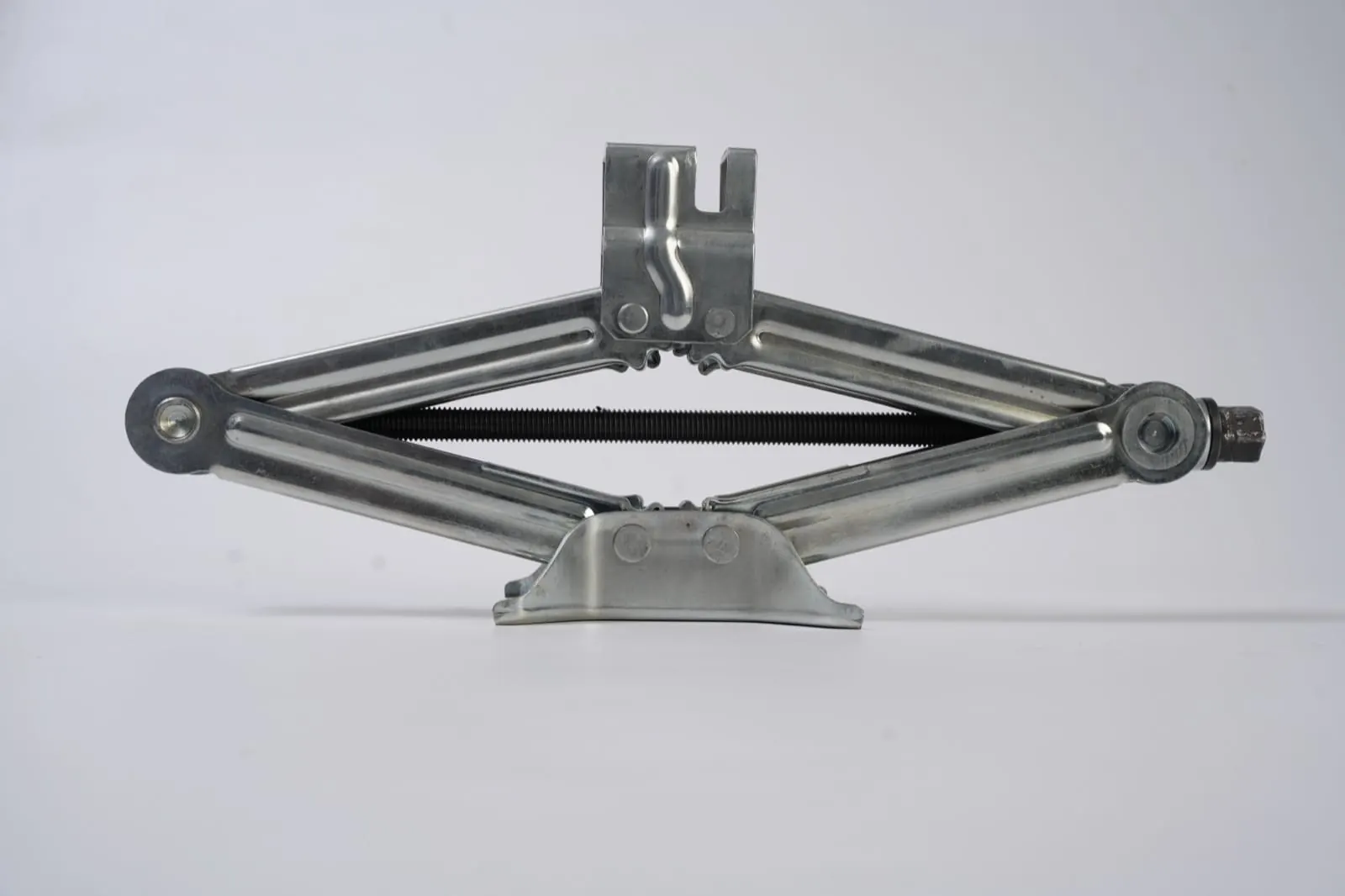 Zinc-plated scissor jack with formed saddle and hex drive end