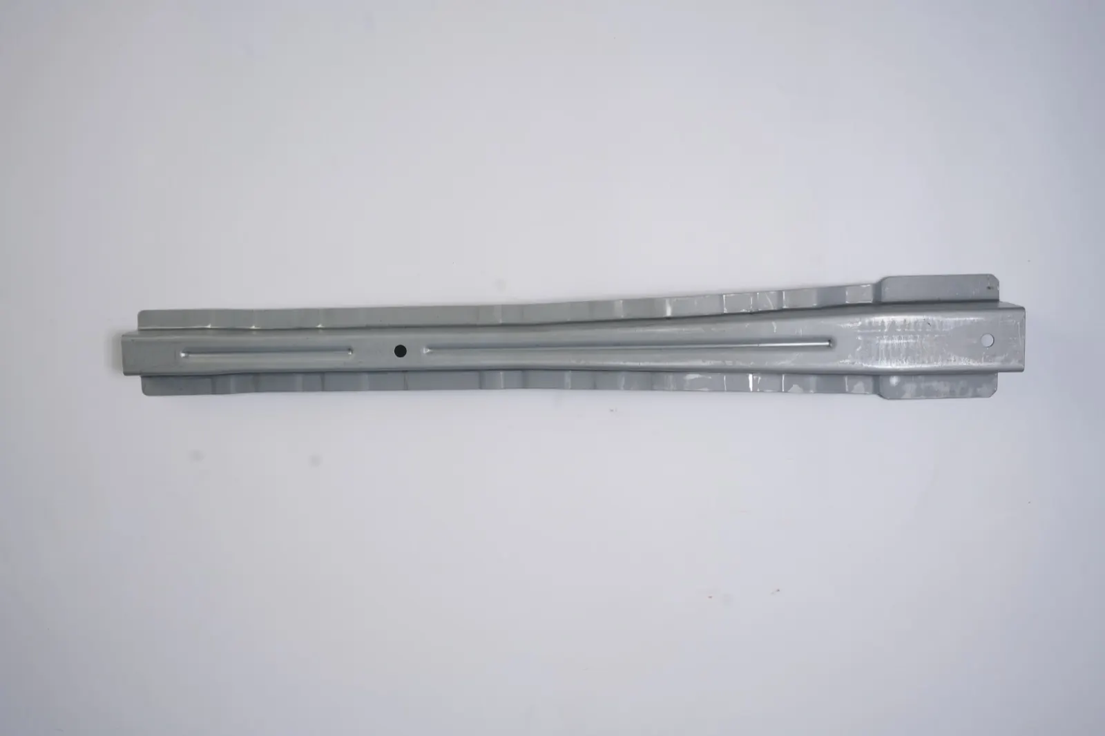 Tapered stamped channel rail with stiffening beads