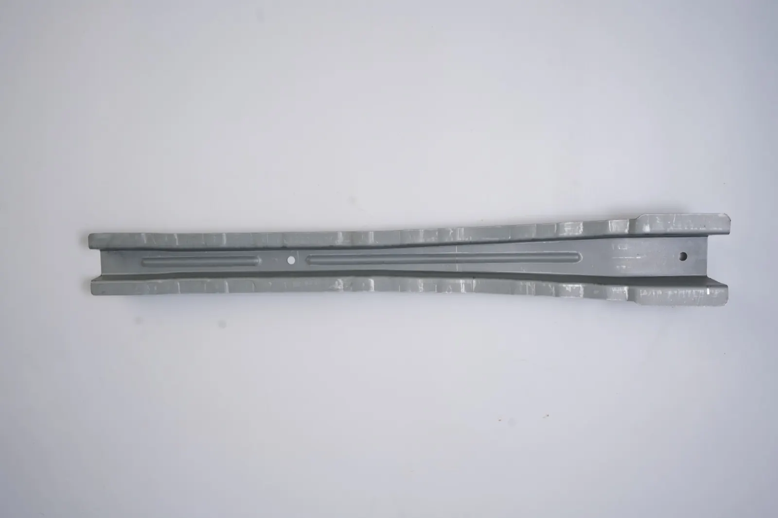 Tapered stamped channel rail, reverse side