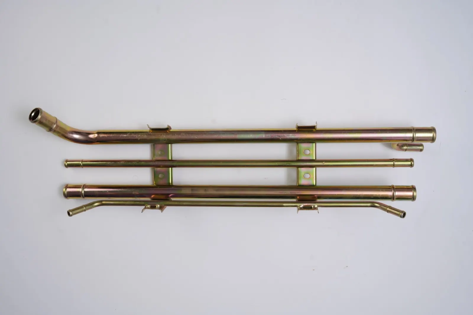 Yellow zinc coolant pipe assembly joined by welded brackets