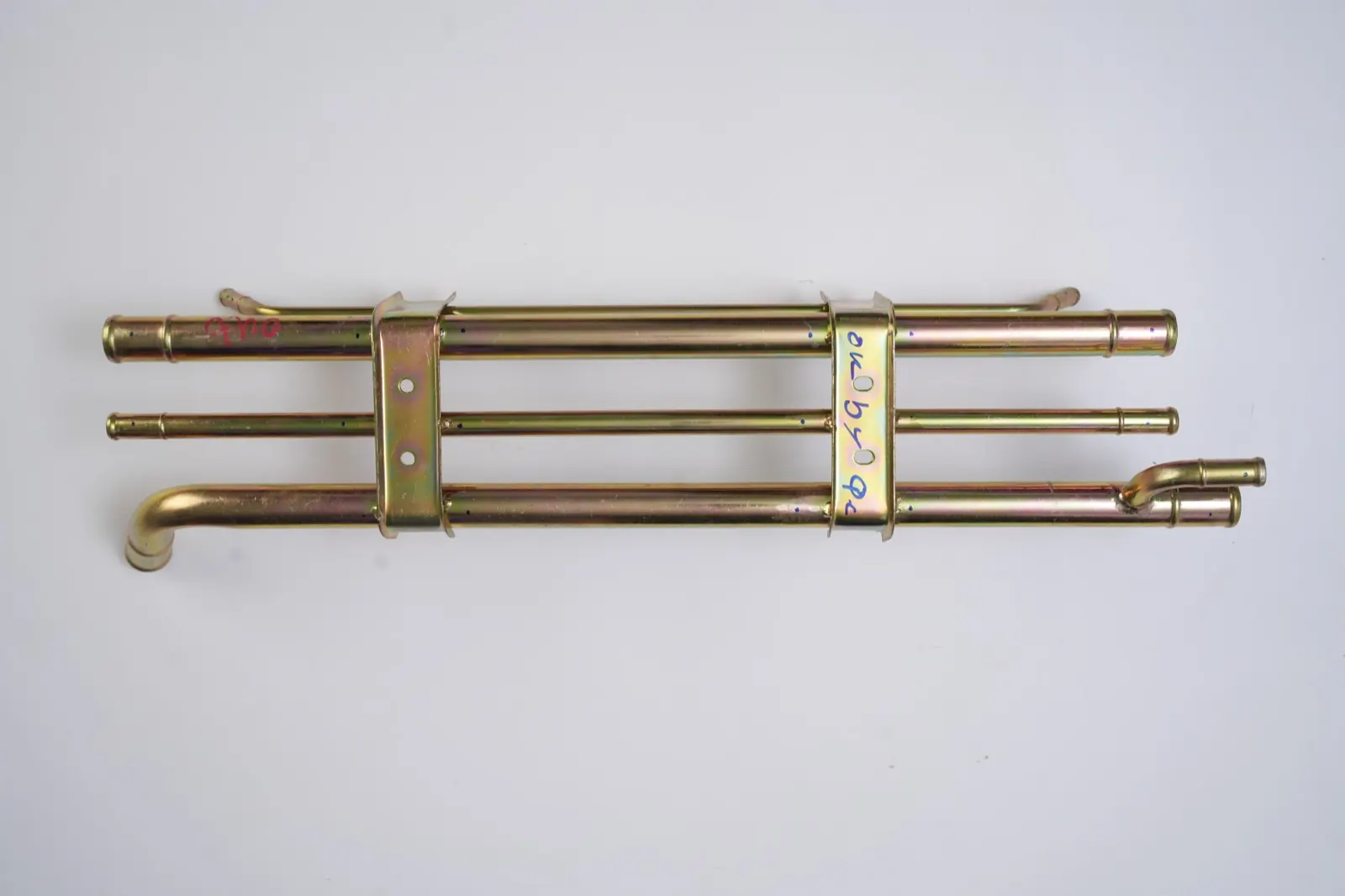 Yellow zinc-plated pipe assembly with clamp brackets