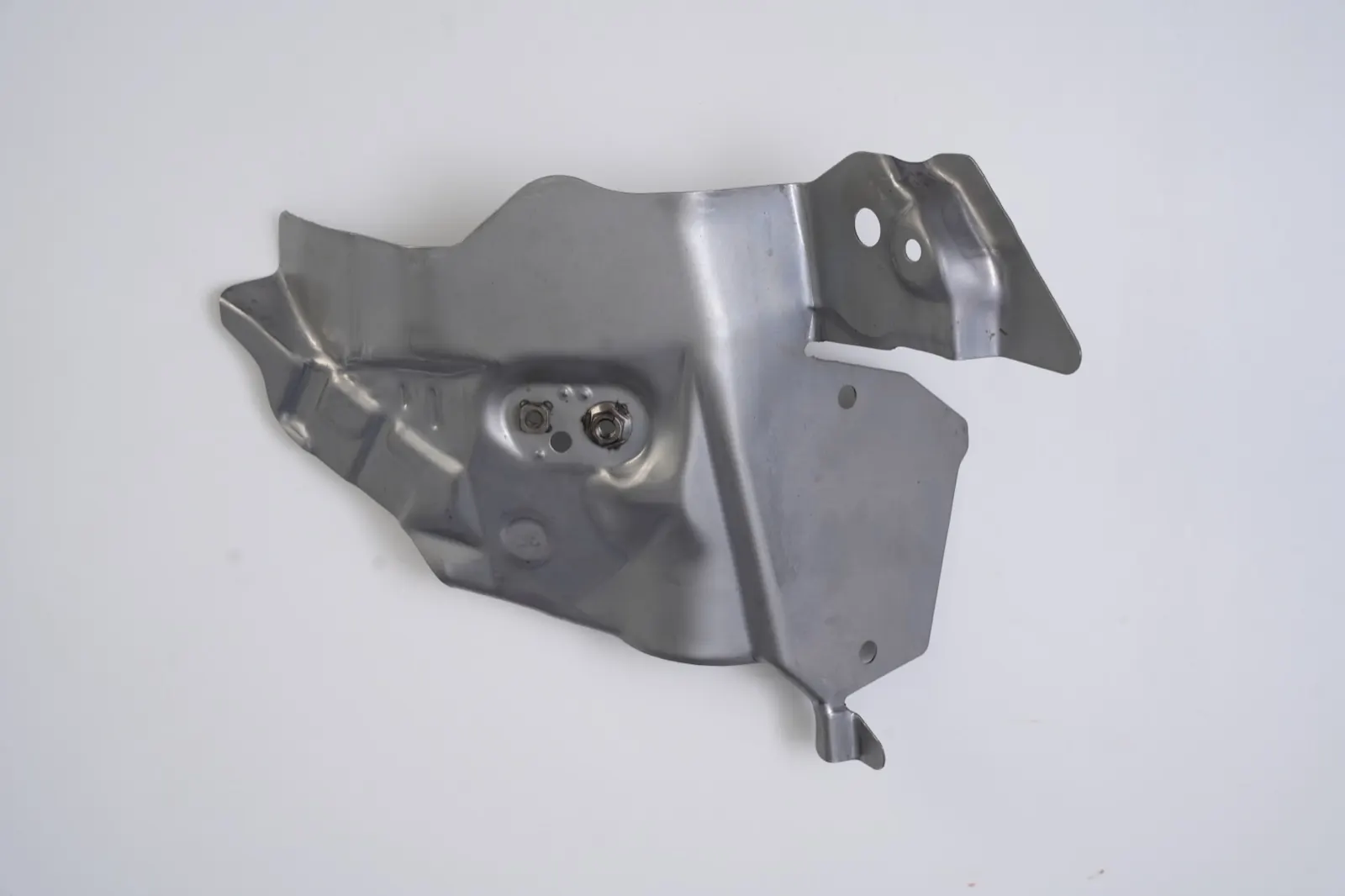 Deep-formed shield bracket with projection-welded nuts